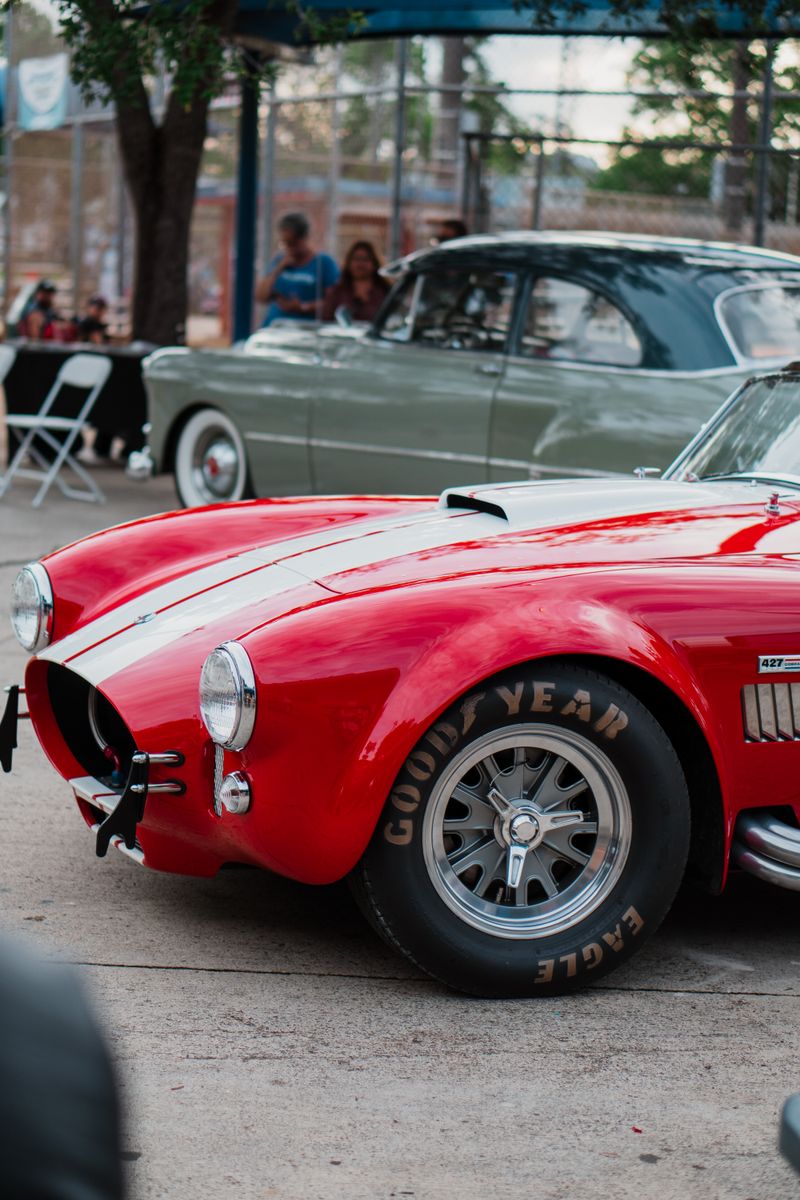 Vintage red sports car on display in Miami, capturing automotive elegance.