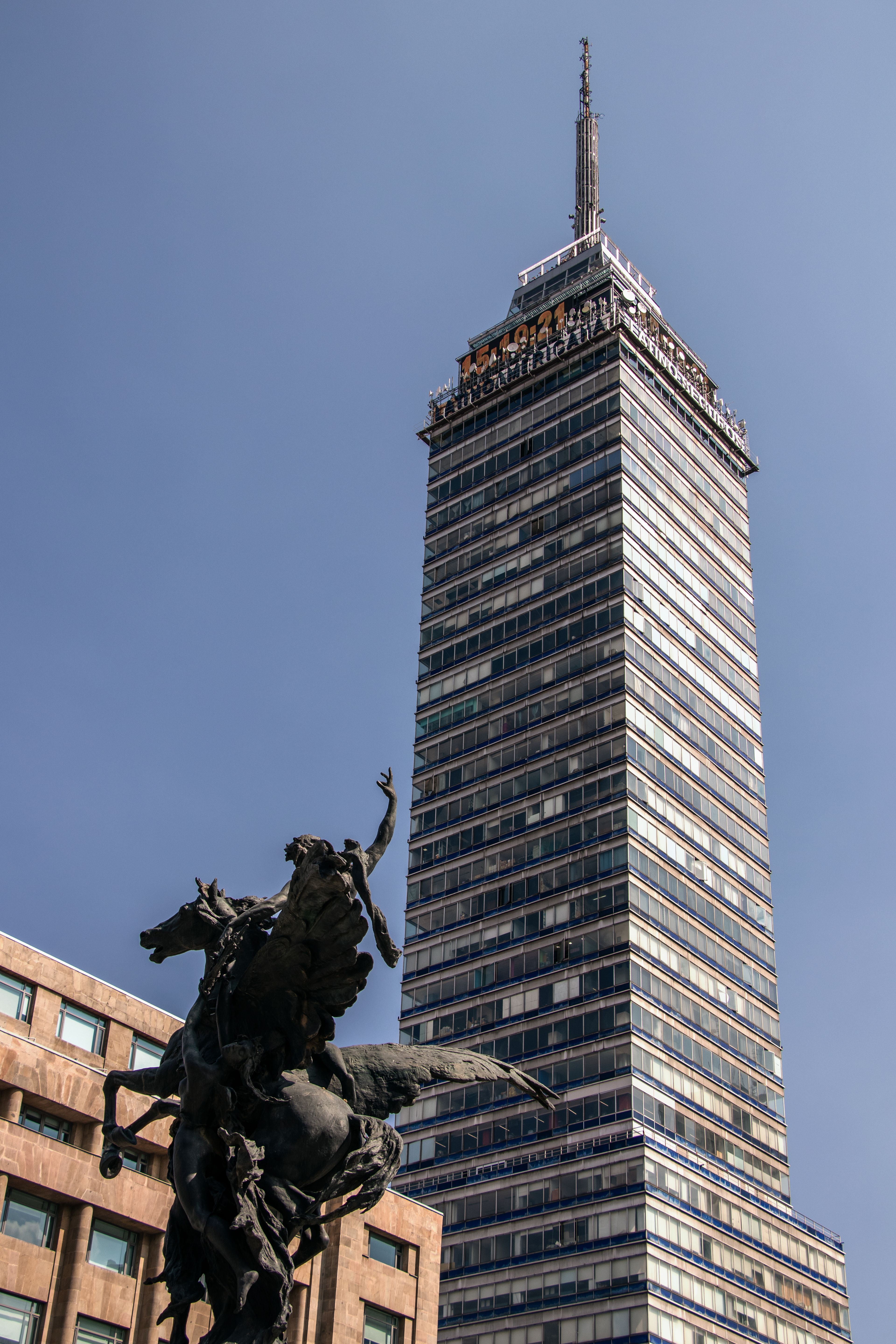 Torre Latinoamericana in Mexico City with Monument · Free Stock Photo