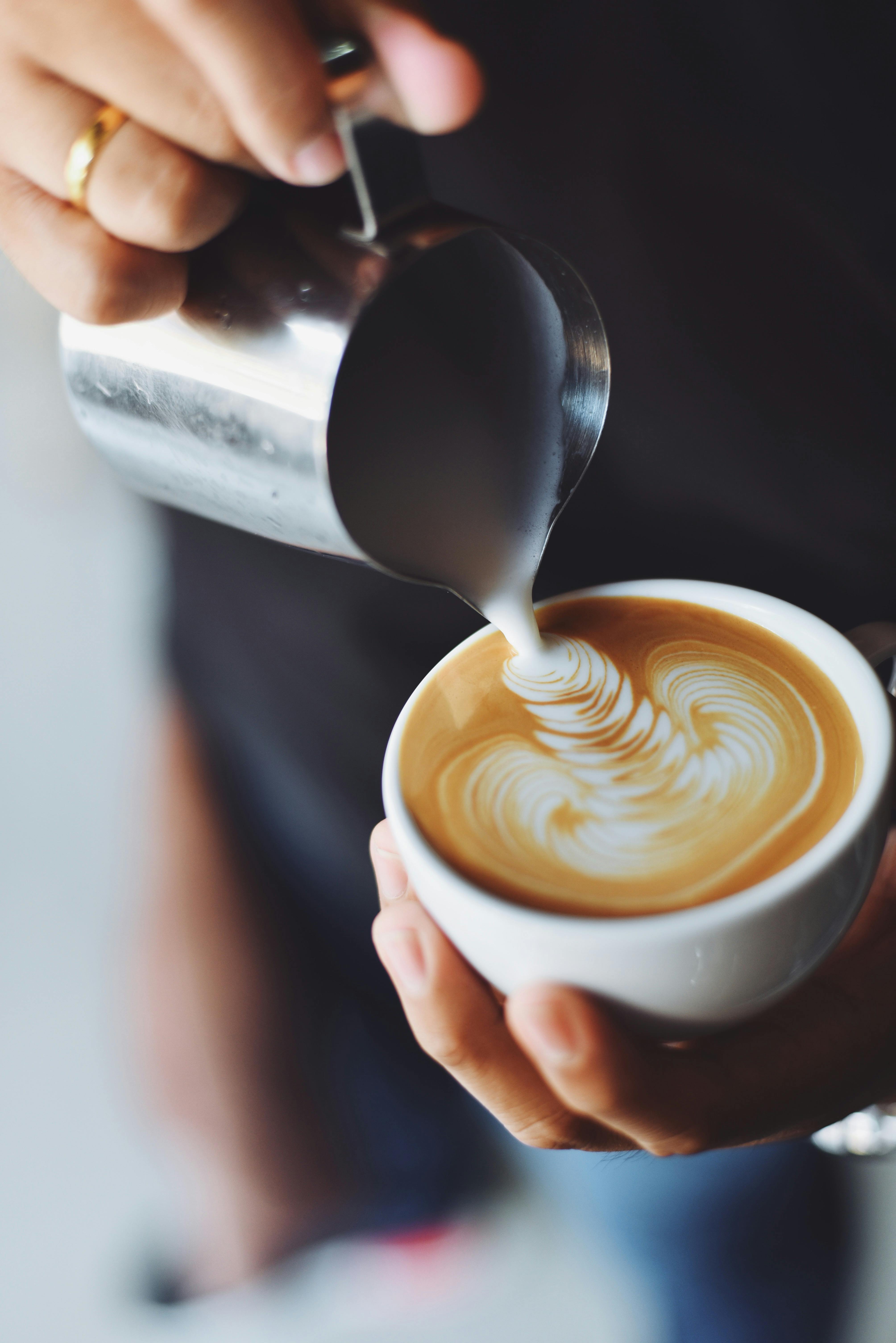 person making espresso