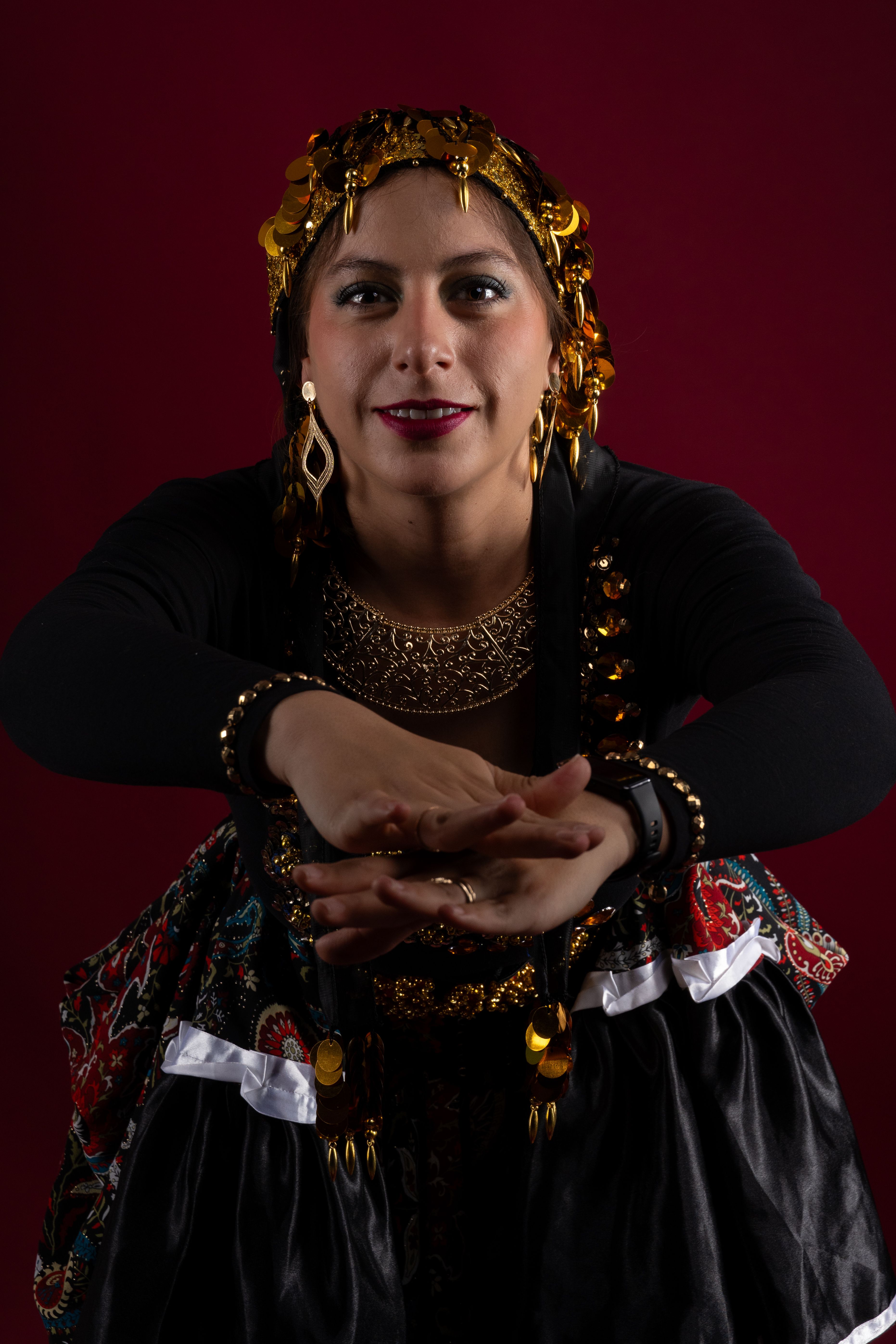 Traditional Dancer in Vibrant Attire with Golden Jewelry · Free Stock Photo