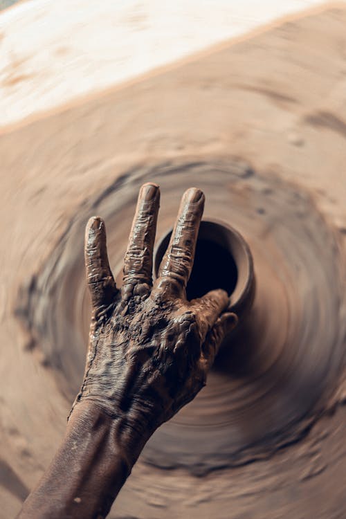 Person Making A Pot