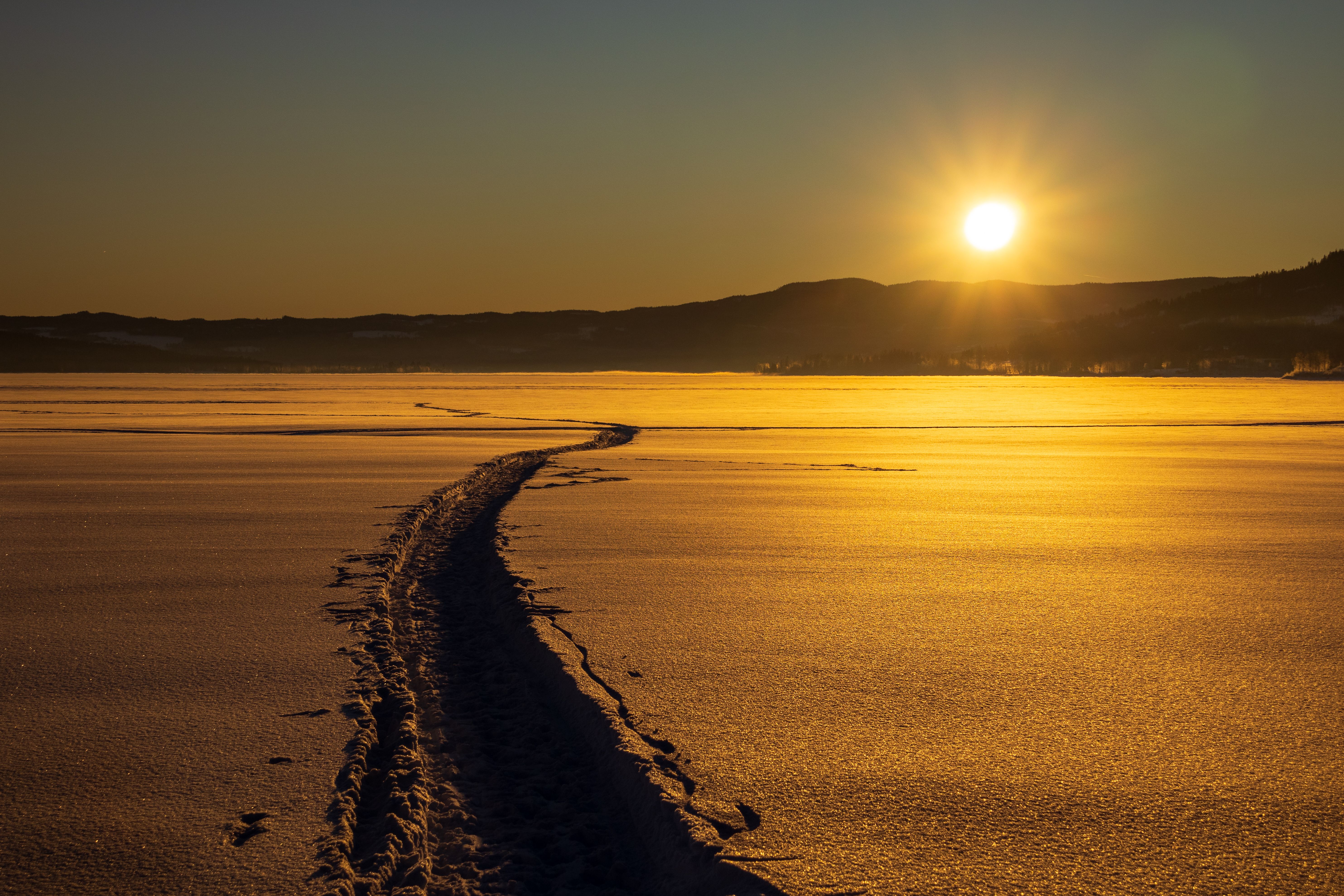 Golden Winter Sunset Over a Frozen Lake · Free Stock Photo