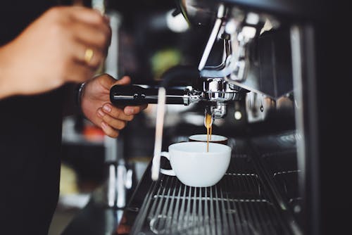 Free Person Using Espresso Machine Stock Photo