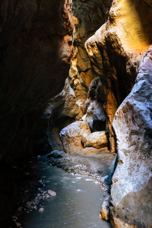 Free Explore the breathtaking beauty of a natural canyon in Muğla, Türkiye, showcasing stunning rock formations and serene waters. Stock Photo