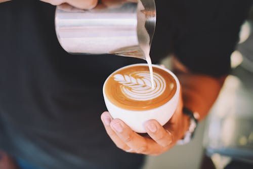 Free Close-up of Hand Holding Cappuccino Stock Photo