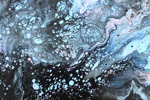Captivating abstract fluid art with marbled blue, black, and white patterns.