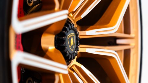 Free Detailed shot of a Lamborghini wheel rim showcasing luxury car design. Stock Photo