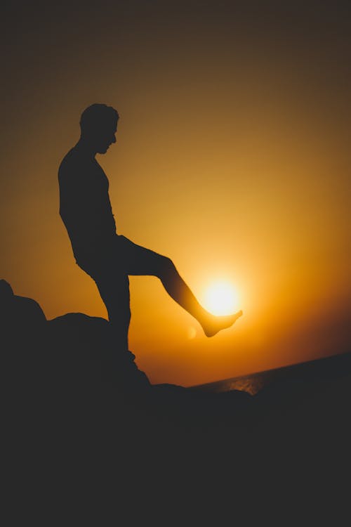 Silhouette Of Man During Golden Hour