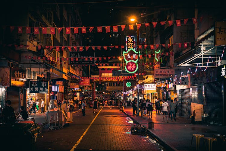 Photo Of People Walking On Street During Night