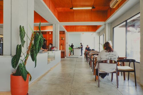 Free Stylish cafe interior in Jawa Barat, Indonesia, featuring minimalistic design and cozy ambiance. Stock Photo