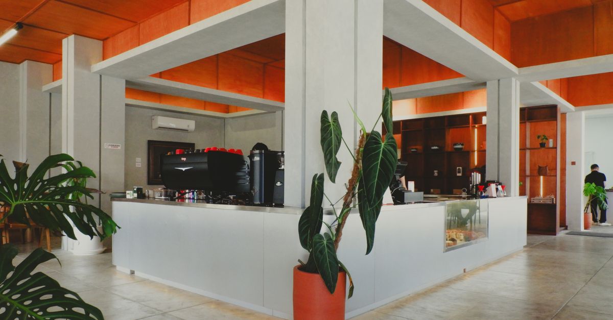 A stylish cafe interior with modern and industrial design elements in Jawa Barat, Indonesia.