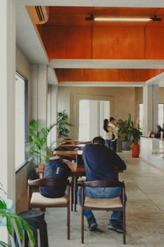 Contemporary cafe interior in Jawa Barat, Indonesia, highlighting modern decor and a cozy atmosphere.