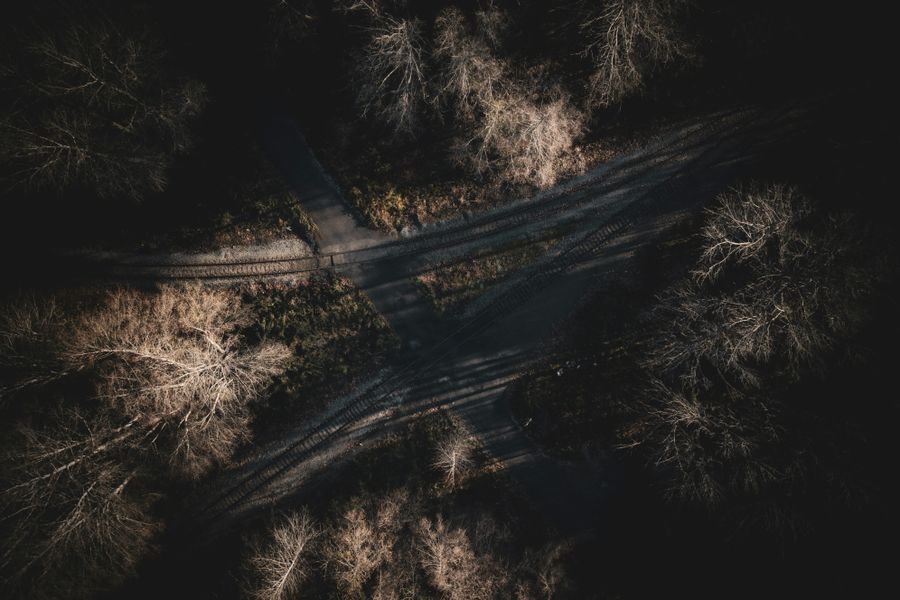 Aerial shot of a forest intersection in British Columbia, Canada during winter.