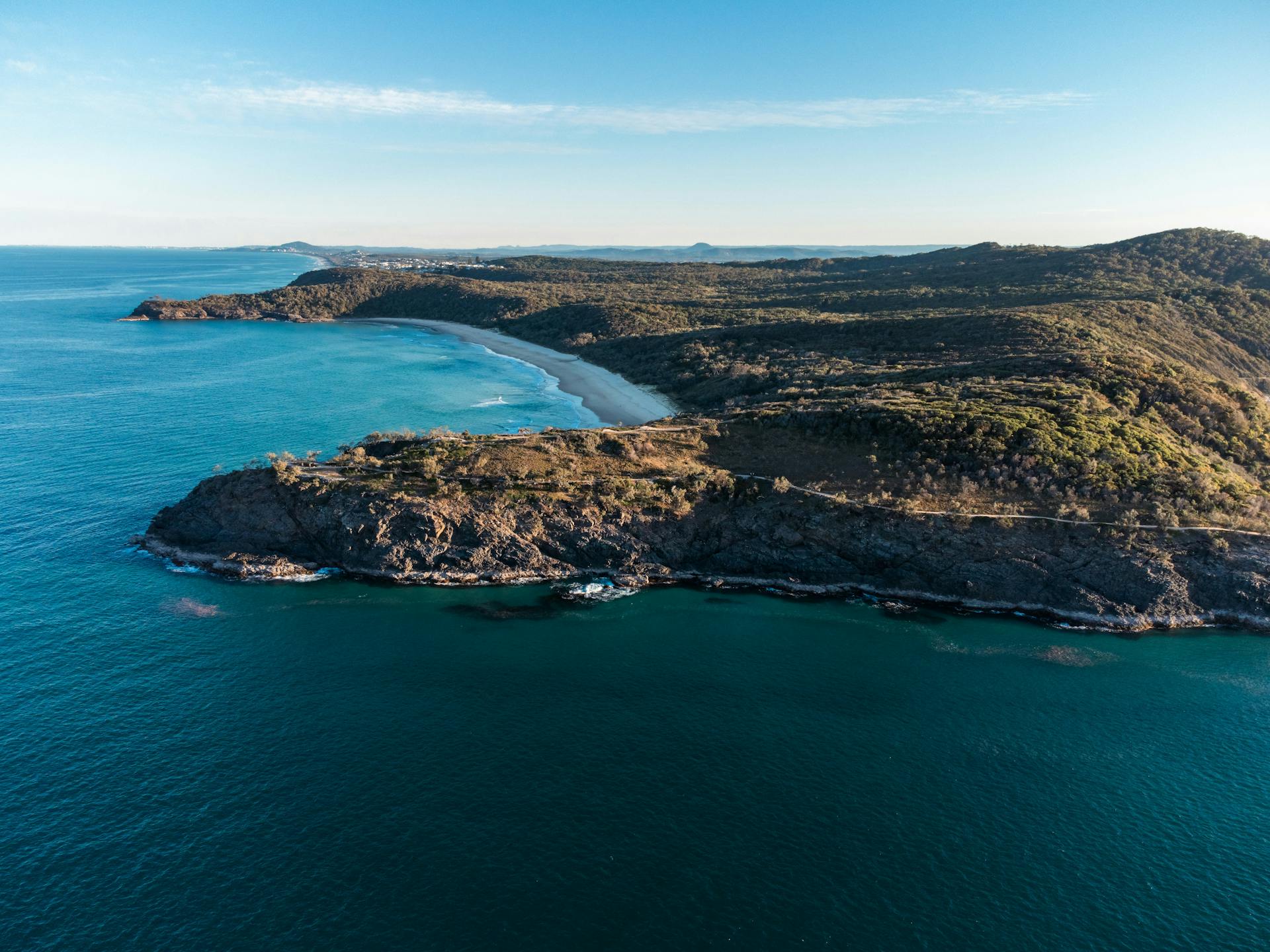 Aerial view of Noosa National Park with rugged coastline and ocean in Queensland, Australia.