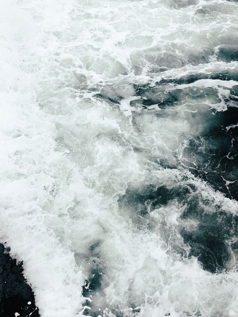 Captivating ocean wave photo showcasing dynamic seafoam patterns and rich textures.