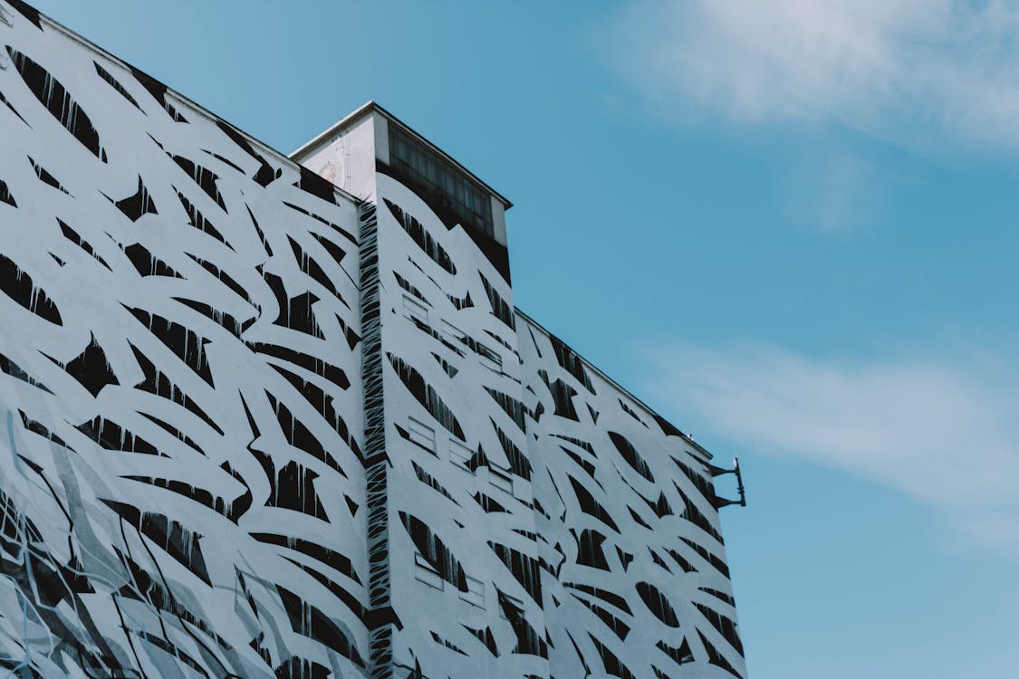 Low Angle Shot Of A Building Exterior With Abstract Design