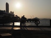 Sunset Silhouette Couple Embrace in Hong Kong