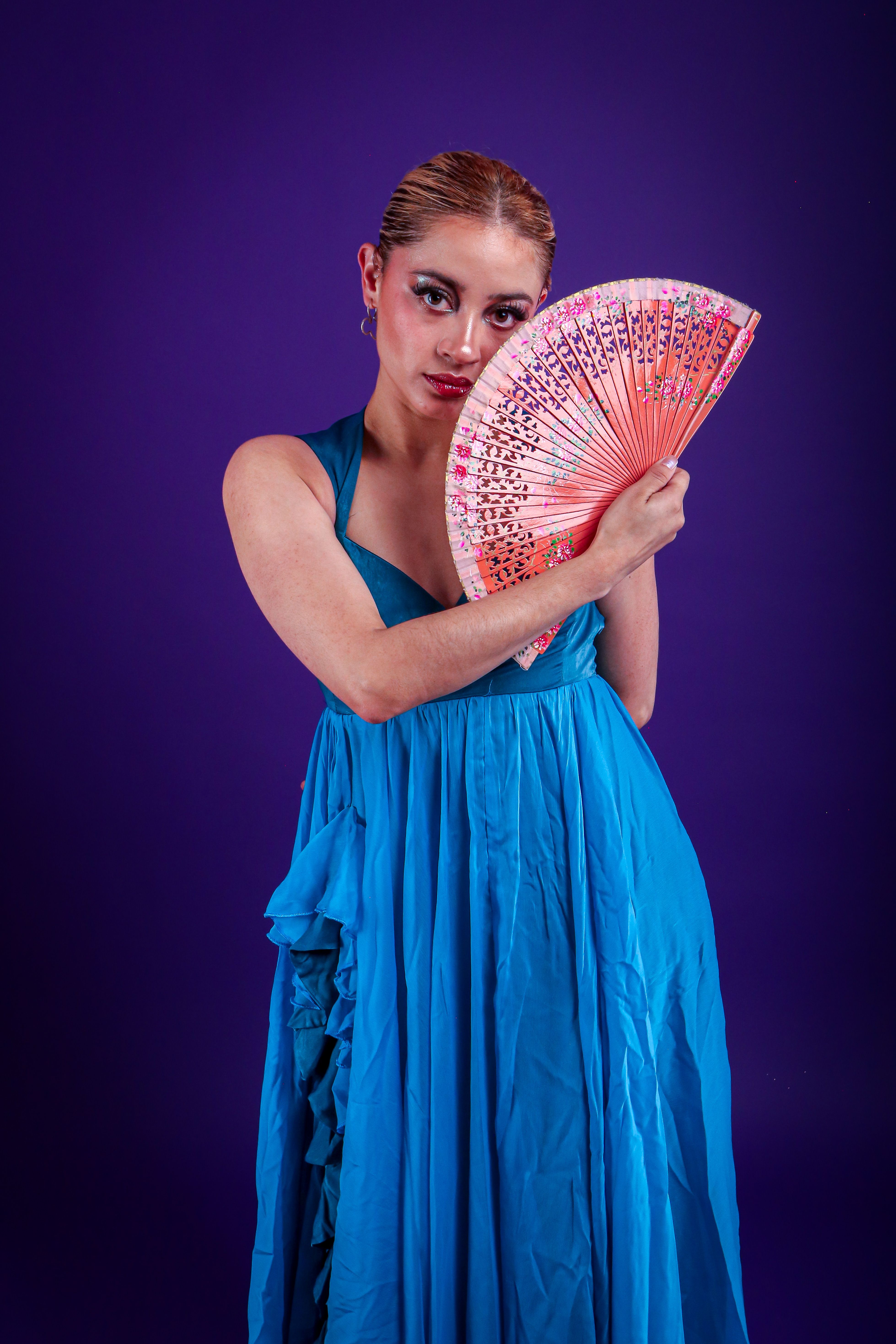 Graceful dancer with fan in vibrant blue dress · Free Stock Photo