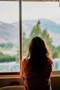 Woman Wearing Brown Shirt Inside Room