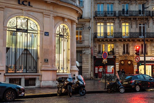 Charming Paris street view at night with illuminated architecture and cobblestone streets.