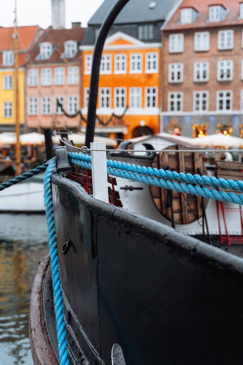 Free Explore the vibrant charm of Copenhagen's Nyhavn harbor with colorful buildings and nautical elements. Stock Photo