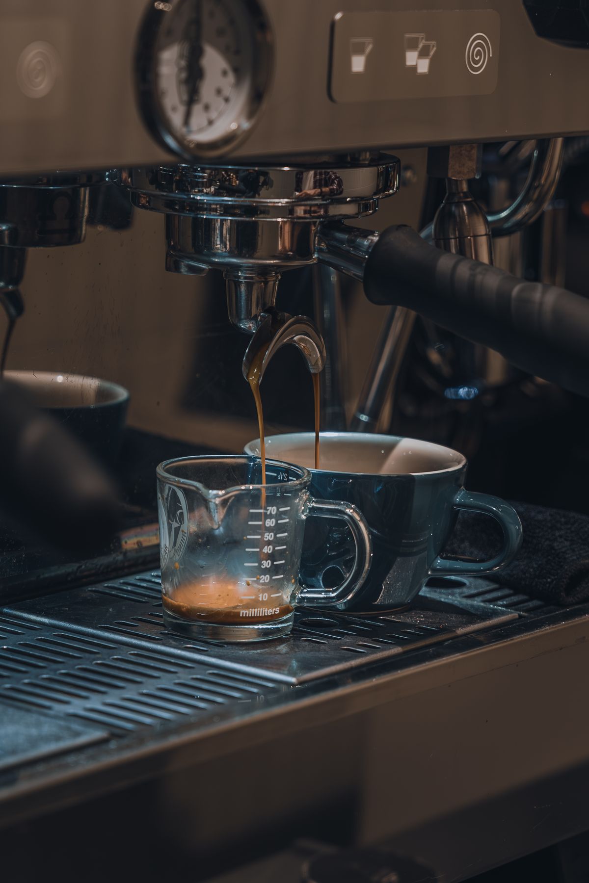 Close-up of espresso brewing from a dual-boiler machine, for illustration