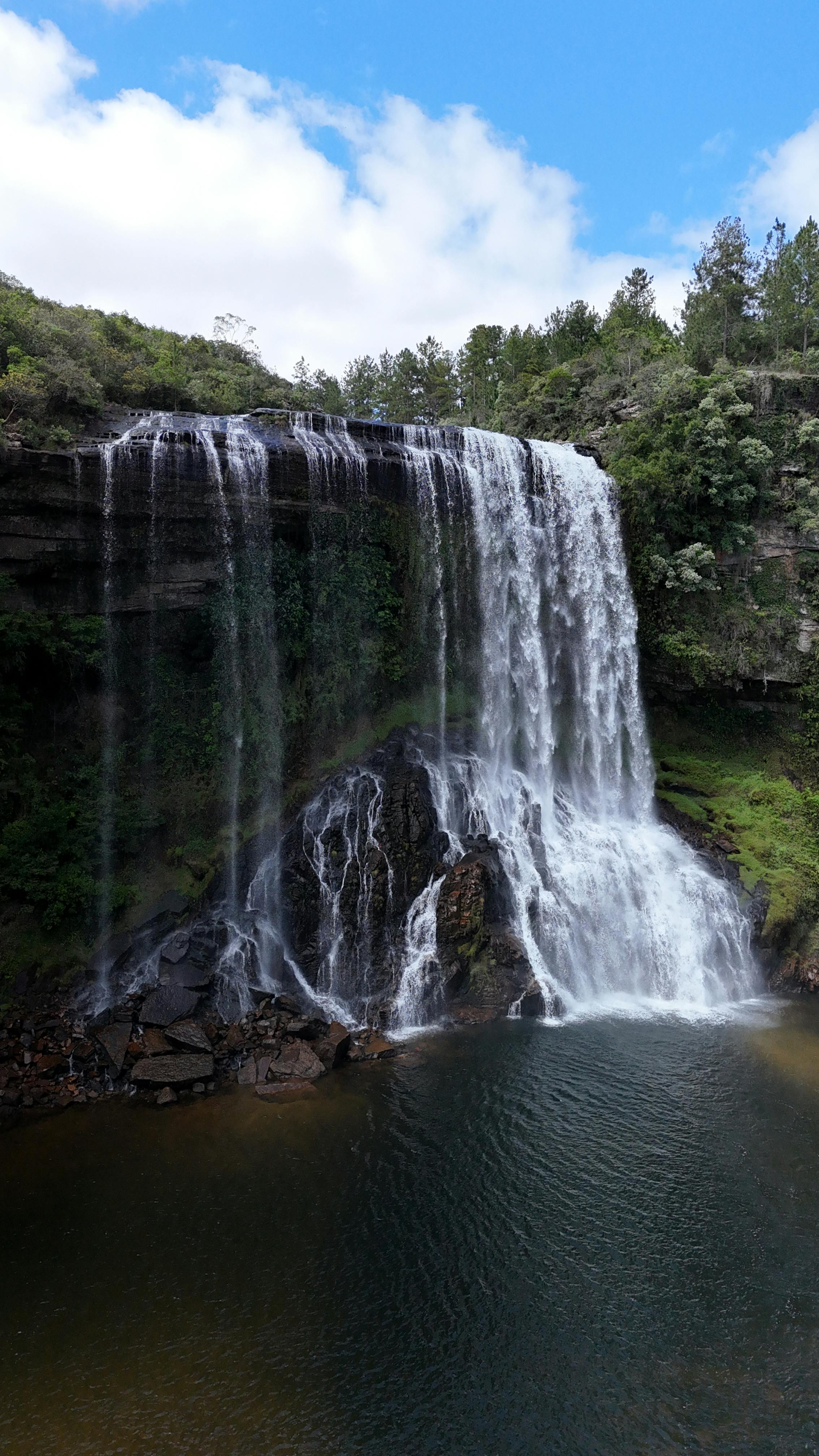 stunning waterfall amidst lush green forest