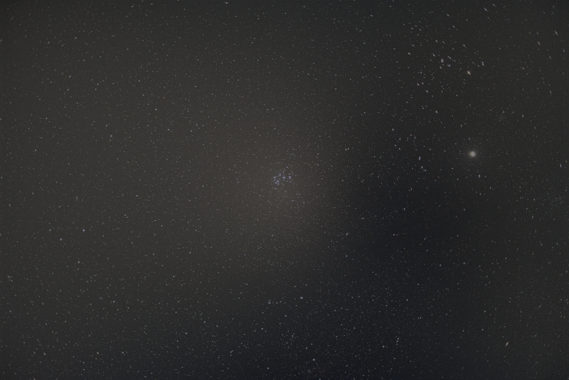 A captivating image of the Pleiades star cluster against the vast night sky.