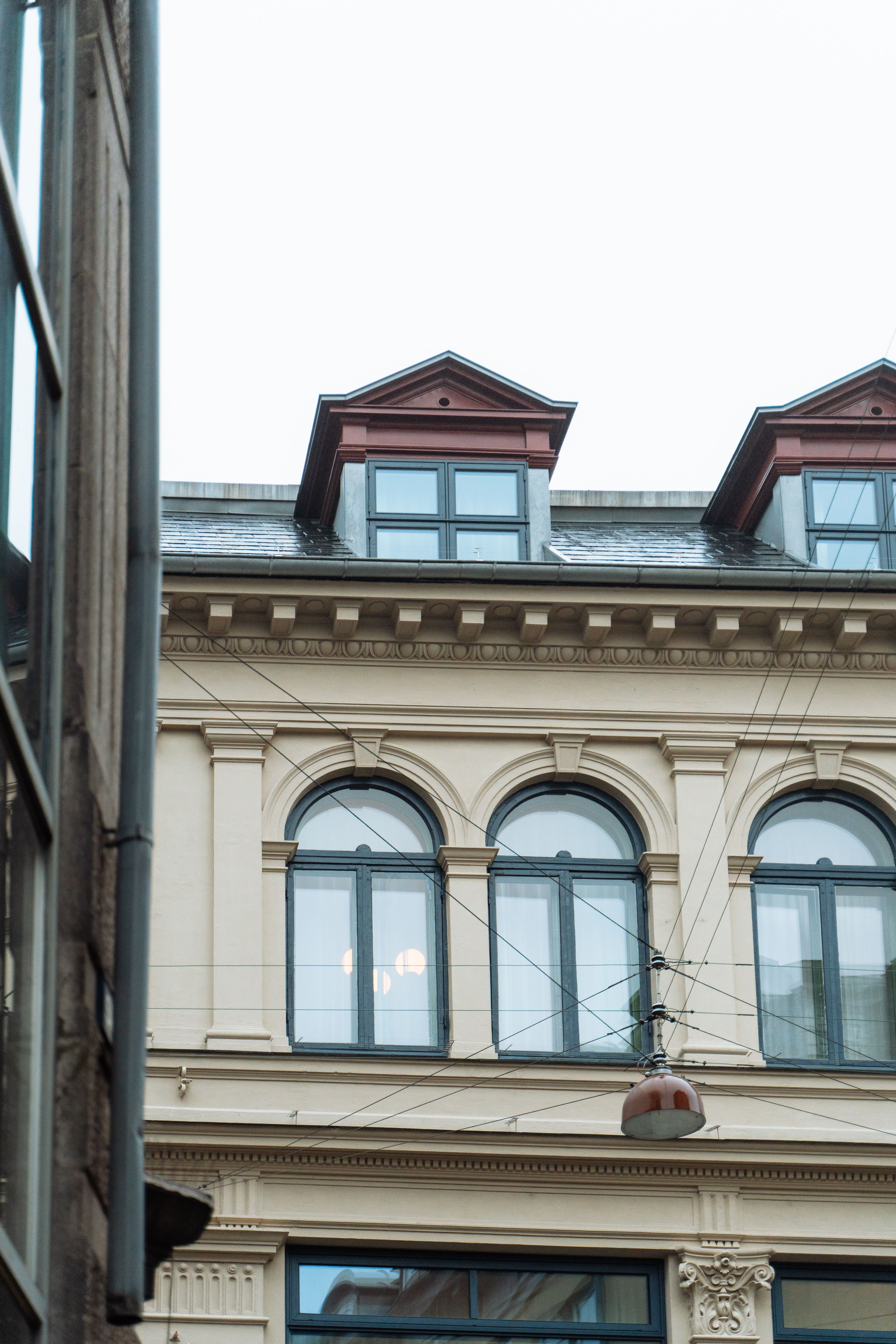 Elegant historic building facade in Copenhagen showcasing European urban style and intricate details.
