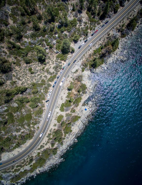 Aerial View of Scenic Coastal Highway with Cars · Free Stock Photo