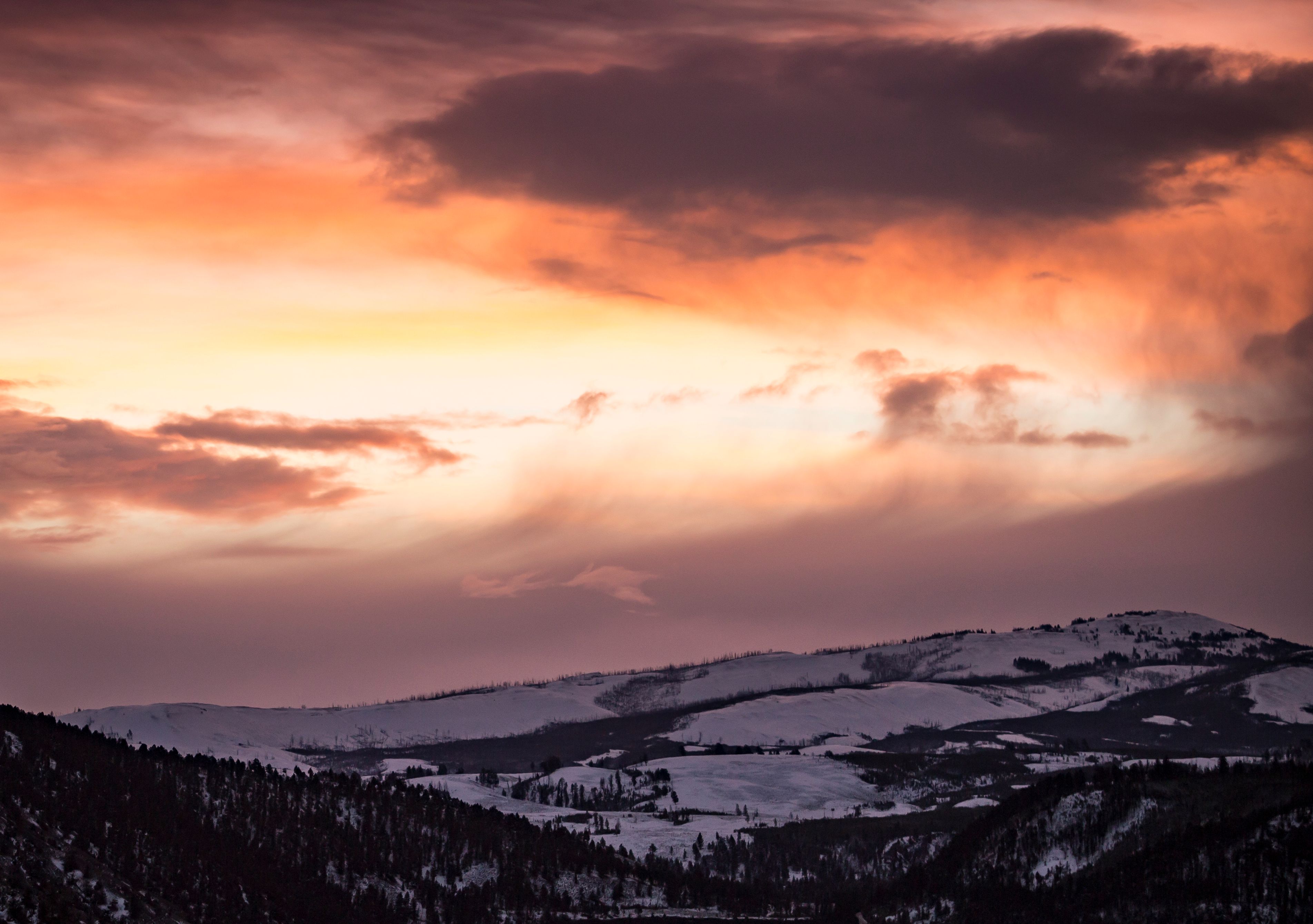 Stunning Winter Sunset Over Snowy Mountains · Free Stock Photo