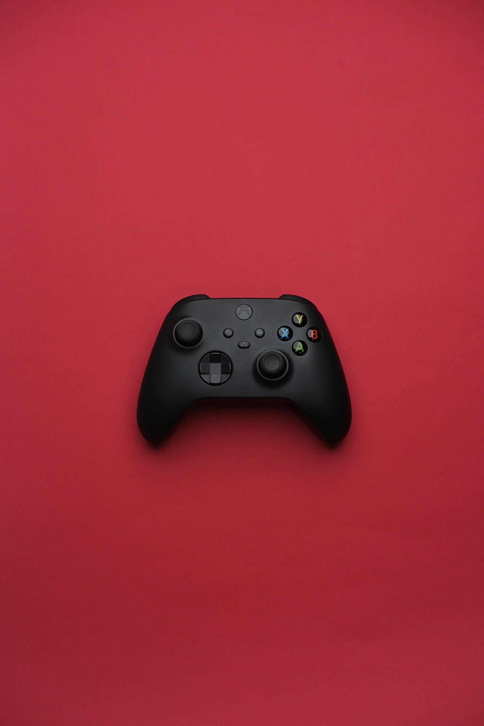Black Gaming Controller on Dark Background · Free Stock Photo