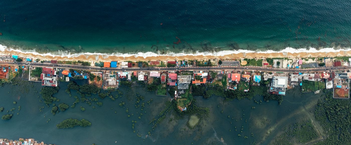 aerial coastal village panorama shot by drone — drone photographer Amsterdam | ProShoot.io