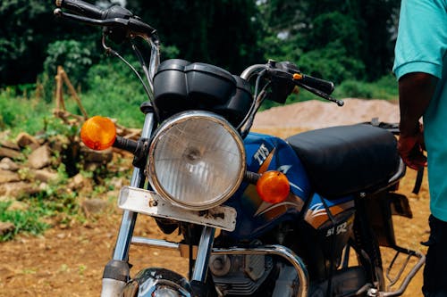 Parked Rundown Blue Backbone Motorcycle