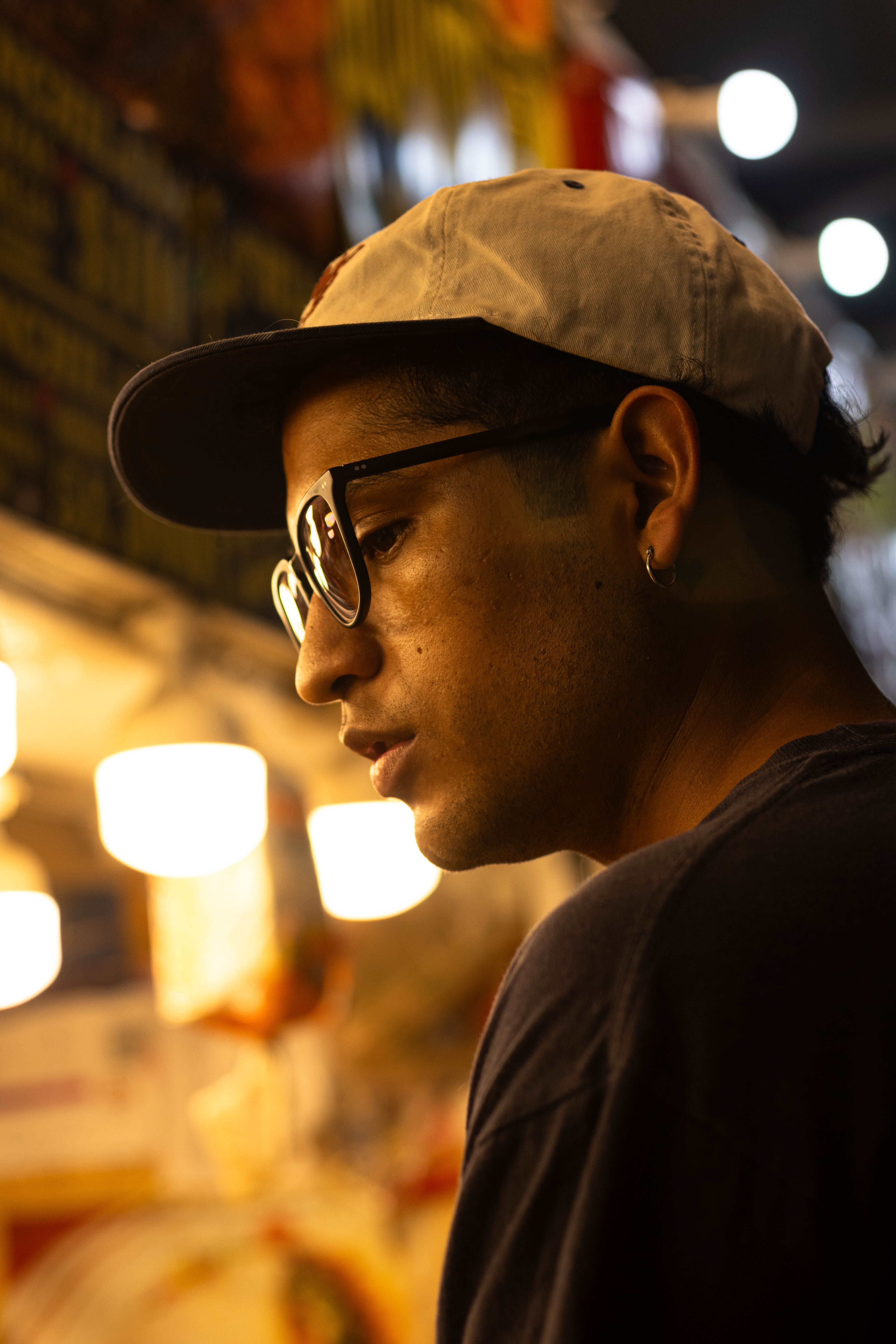 Portrait of a Young Man at Night Market · Free Stock Photo