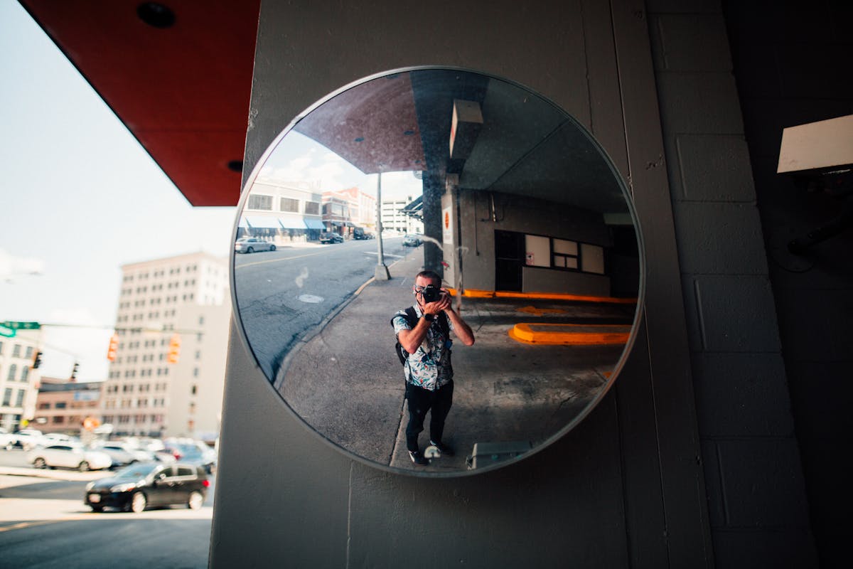 Man Standing in Front of the Mirror
