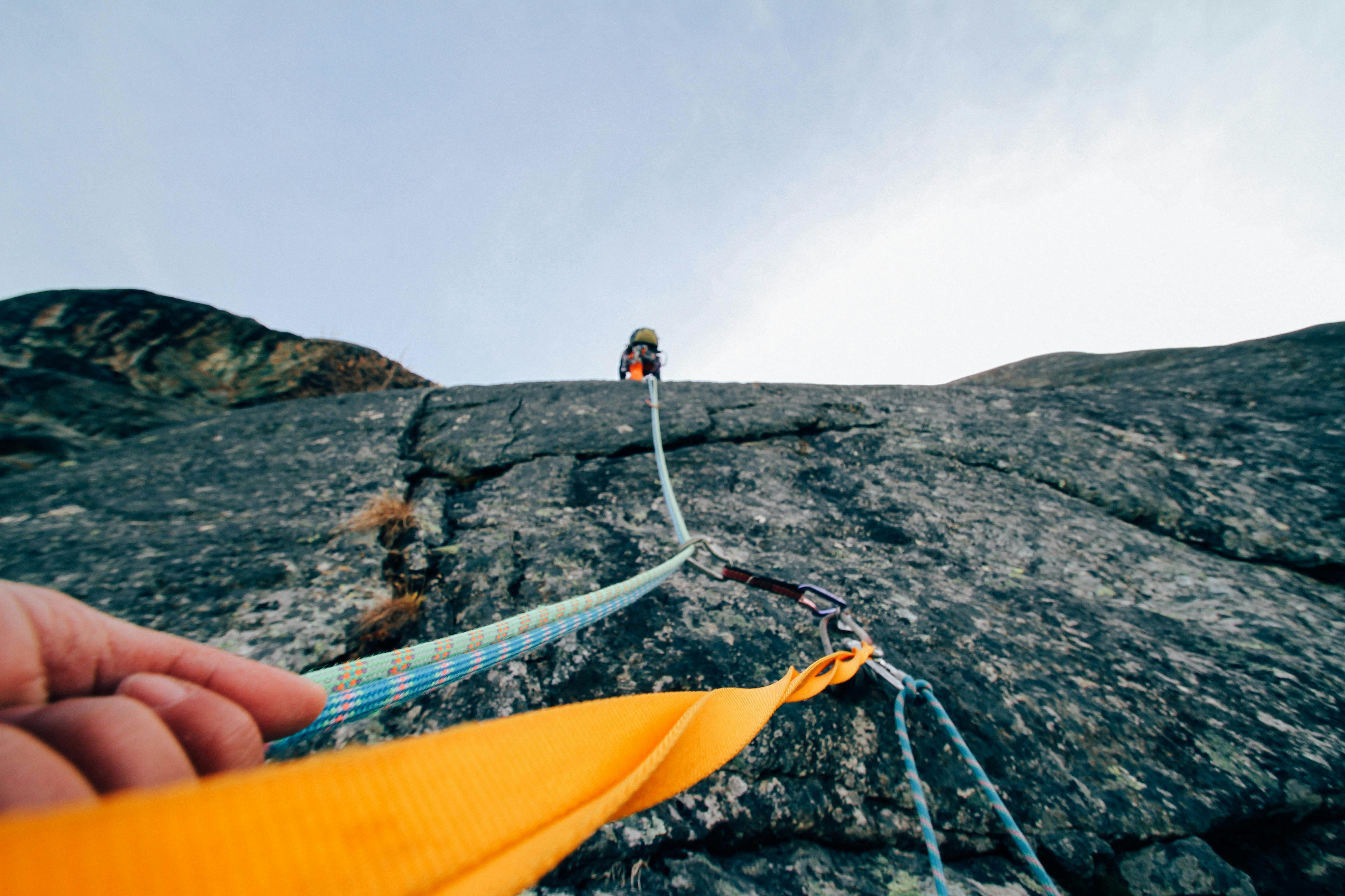 HD wallpaper man doing rock climbing in between of gray rock formation  extreme Sports  Wallpaper Flare