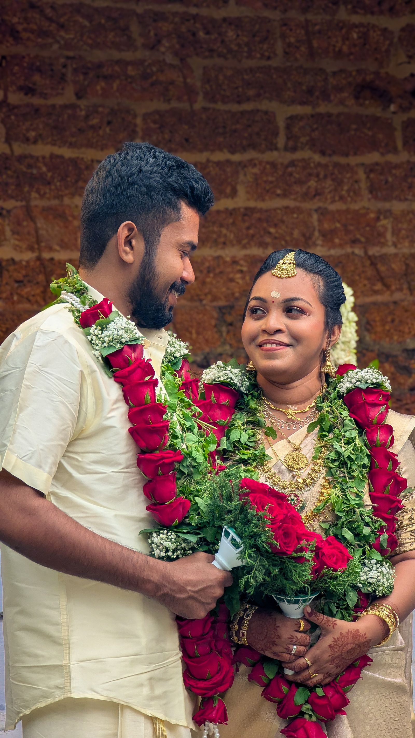 South Indian wedding couple exchanging garlands