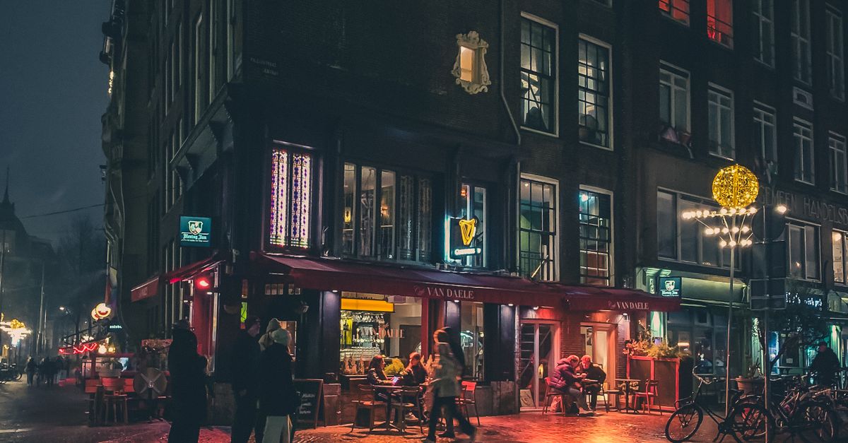 Amsterdam Street Scene at Night with Reflections · Free Stock Photo