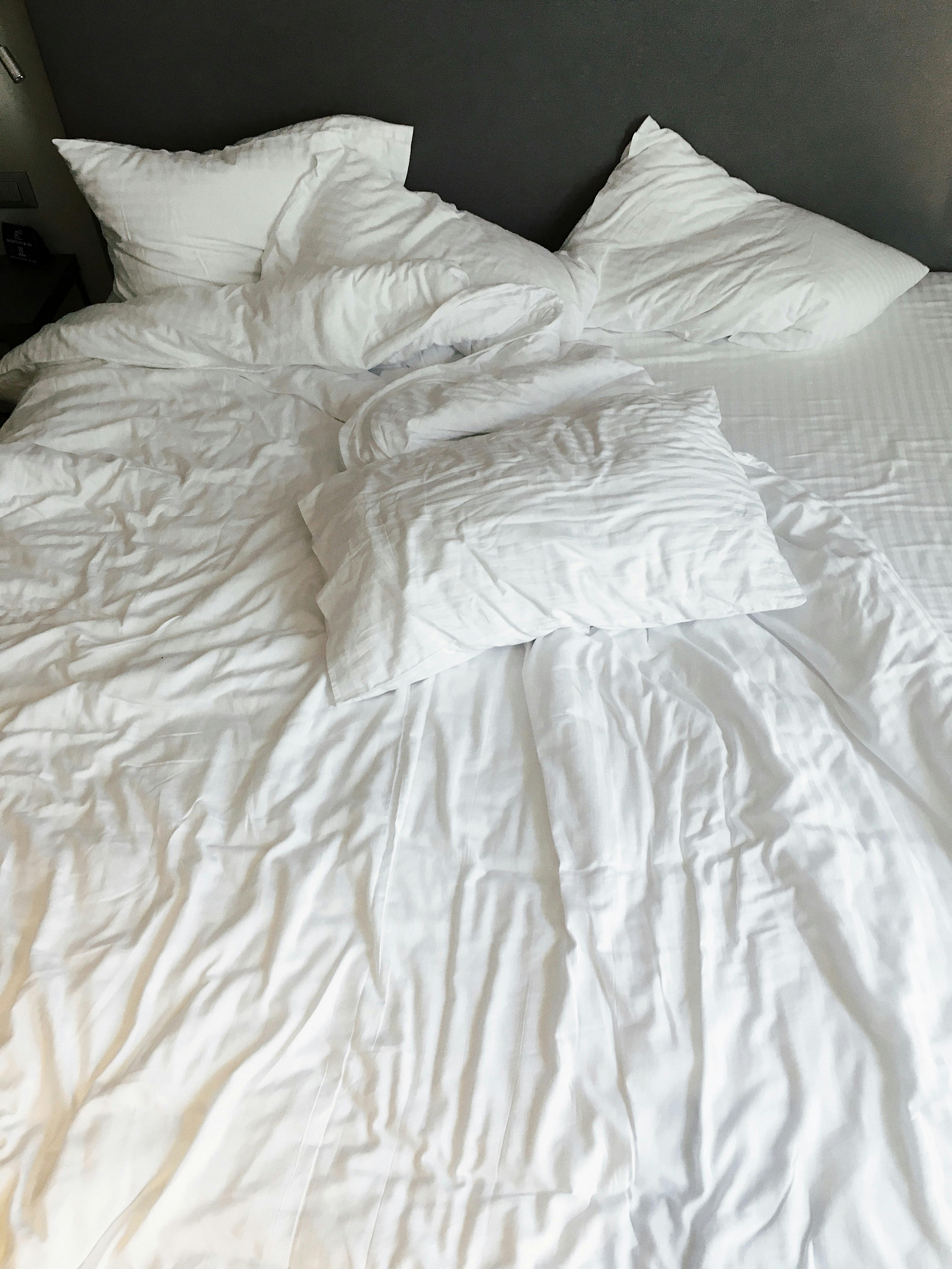 white pillows and bed linen