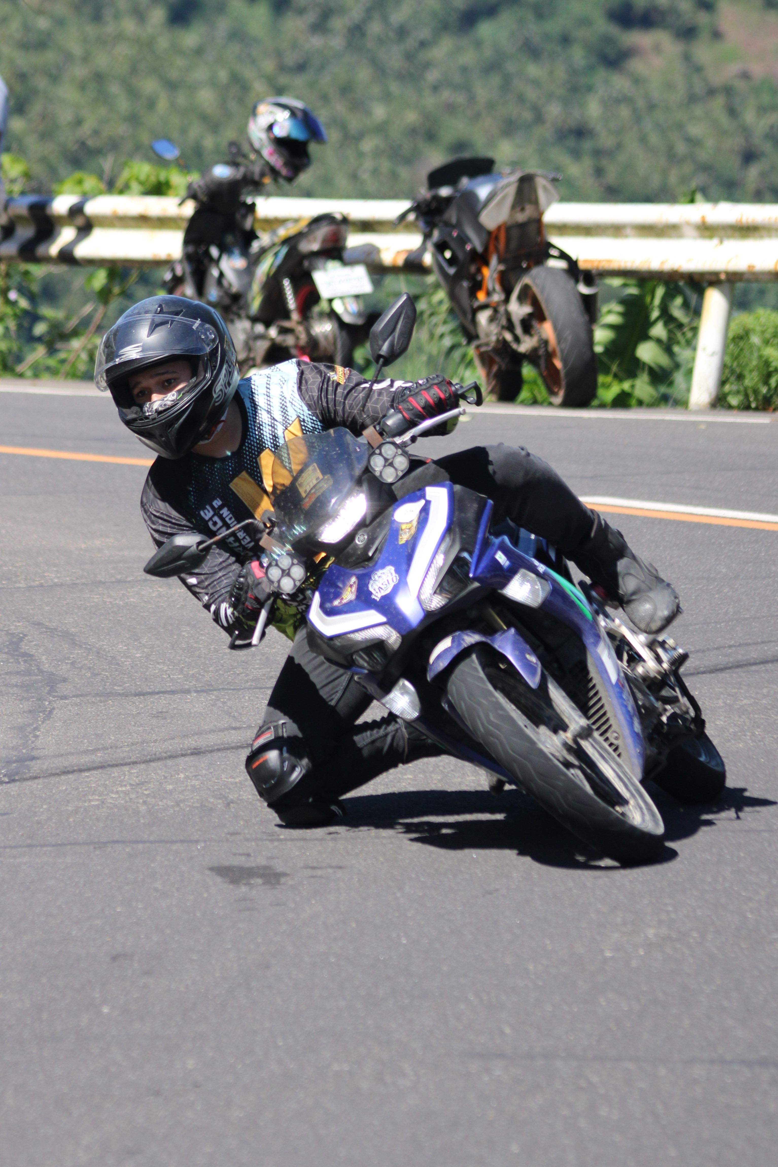 Dynamic Motorcycle Racer on a Curvy Road · Free Stock Photo