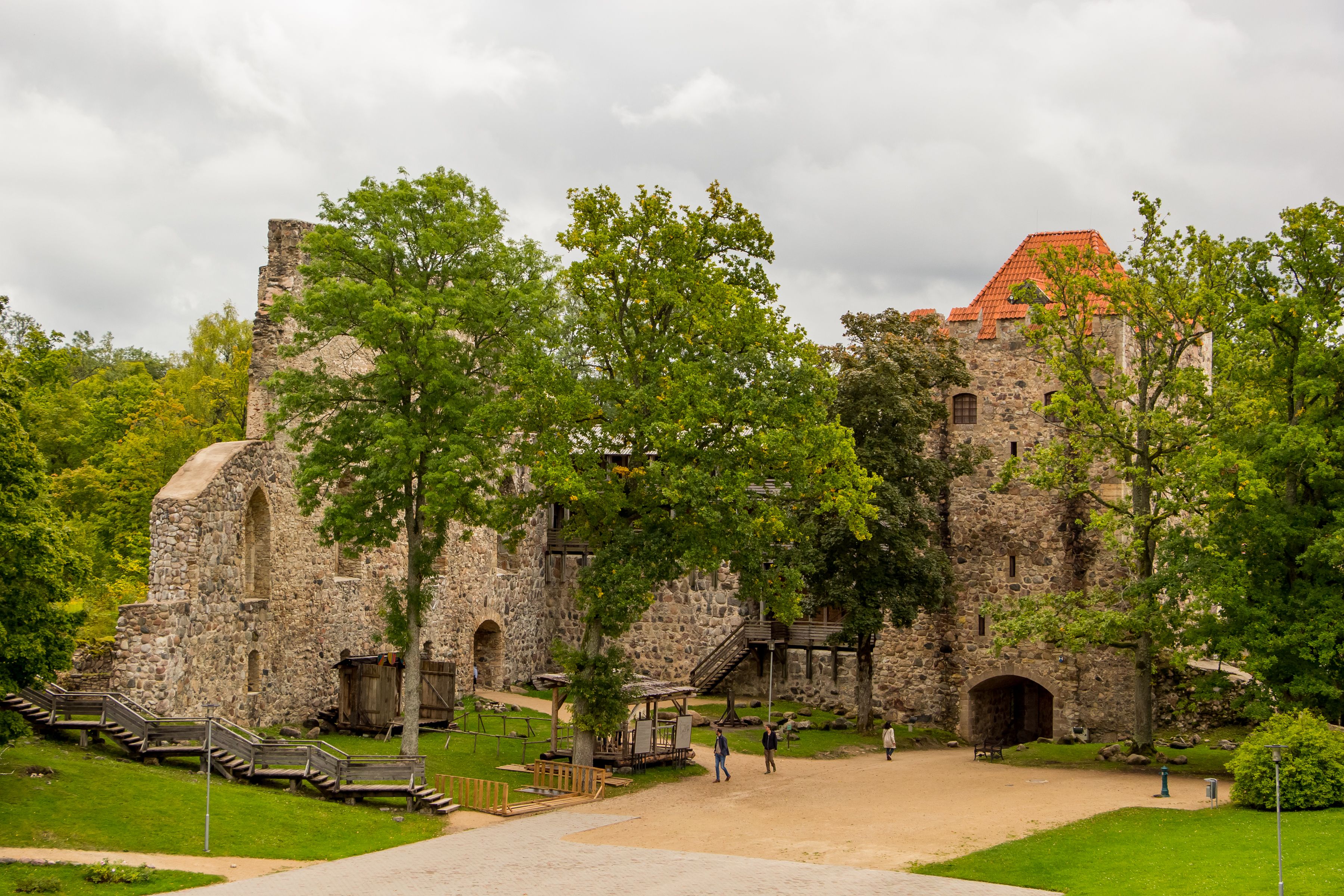 The Tarvas aurochs statue below the stone walls of Rakvere castle
