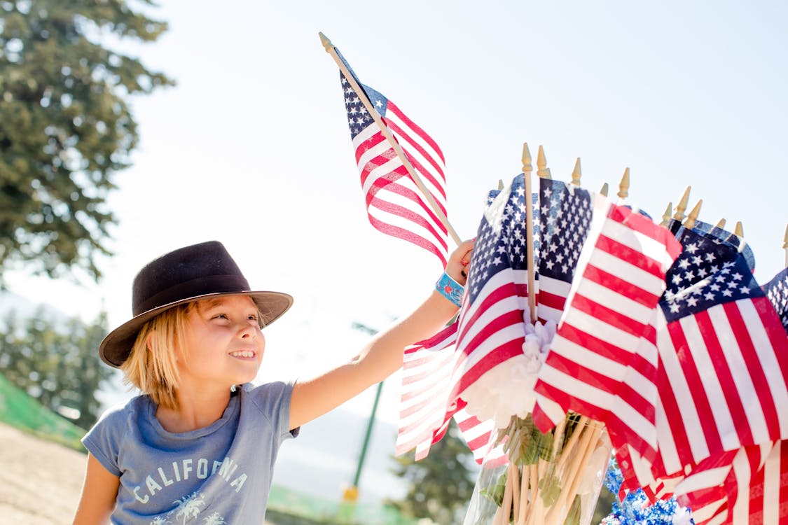 Free Kid Holding USA Flag Stock Photo