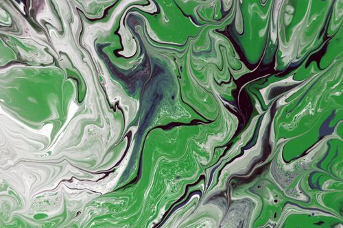 Free Dynamic green and white abstract fluid art with swirling patterns. Stock Photo