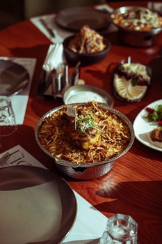 Savor the rich flavors of Iraqi biryani and Middle Eastern dishes in a warm setting.