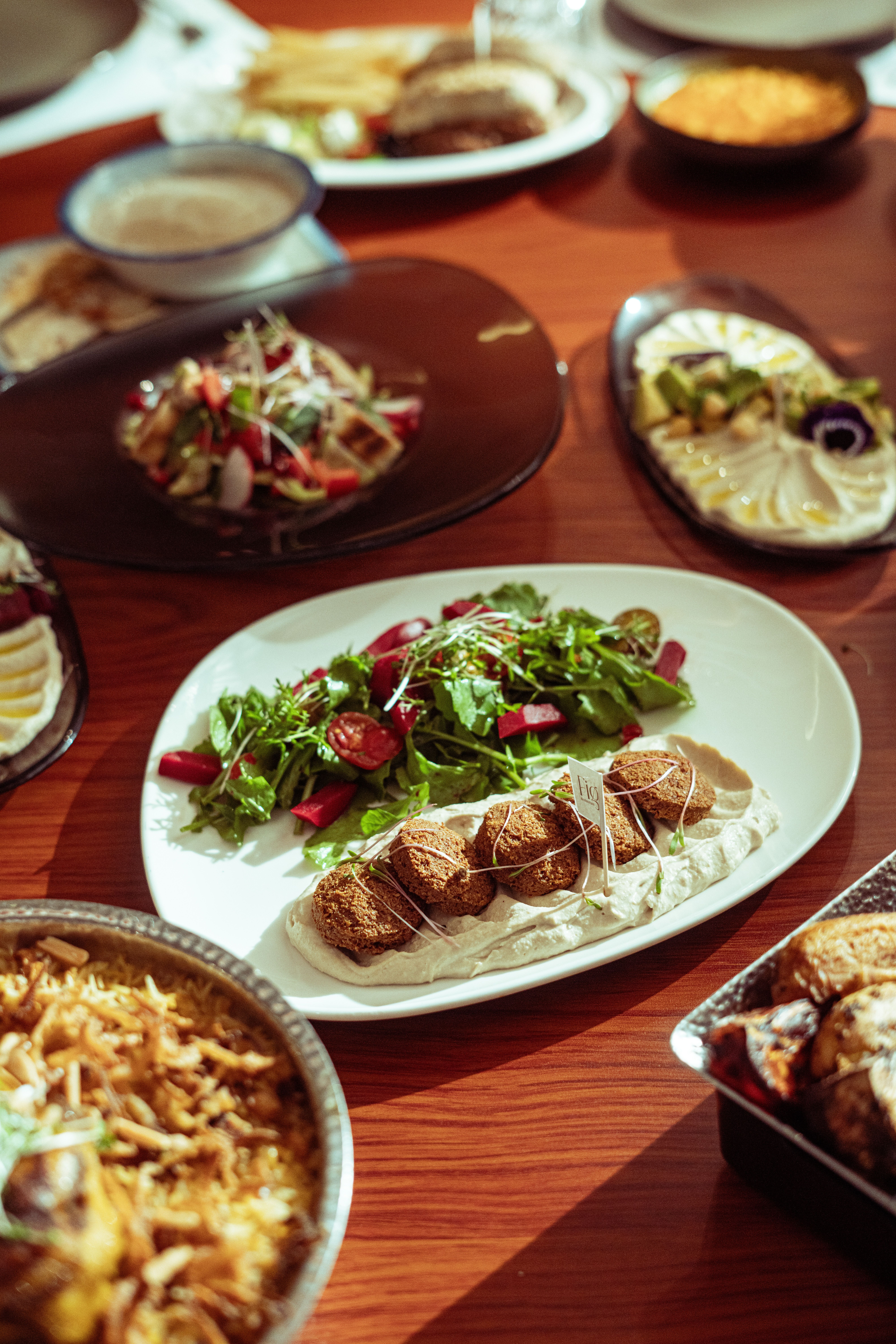 Close-up of flavorful Middle Eastern cuisine on a wooden table in Baghdad, Iraq.