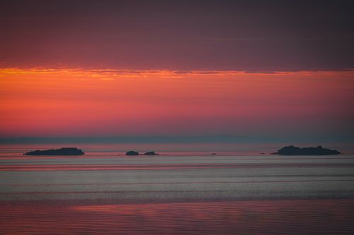 Free A tranquil sunrise over the islands at Cove Island Park, Stamford, Connecticut. Stock Photo