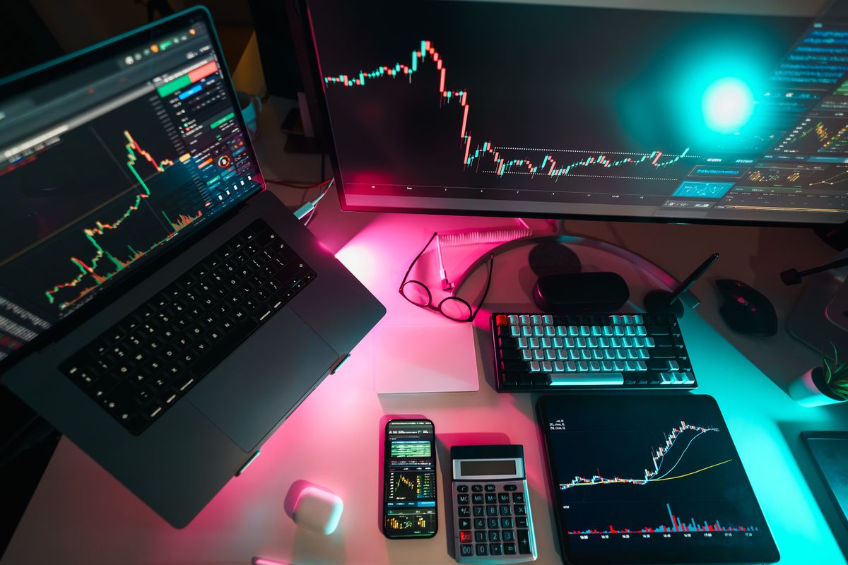 Modern trading workstation with digital charts across several screens