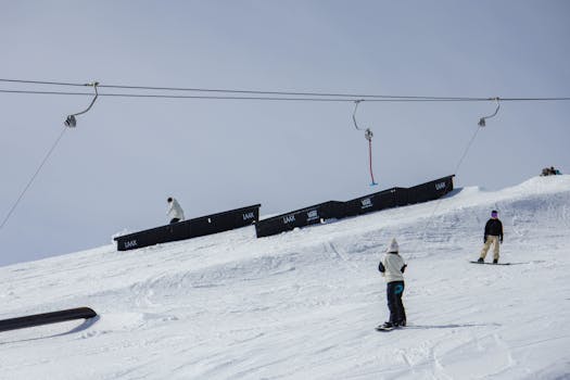 Snowboarders enjoy a thrilling day on the snowy slopes of Laax, Switzerland.