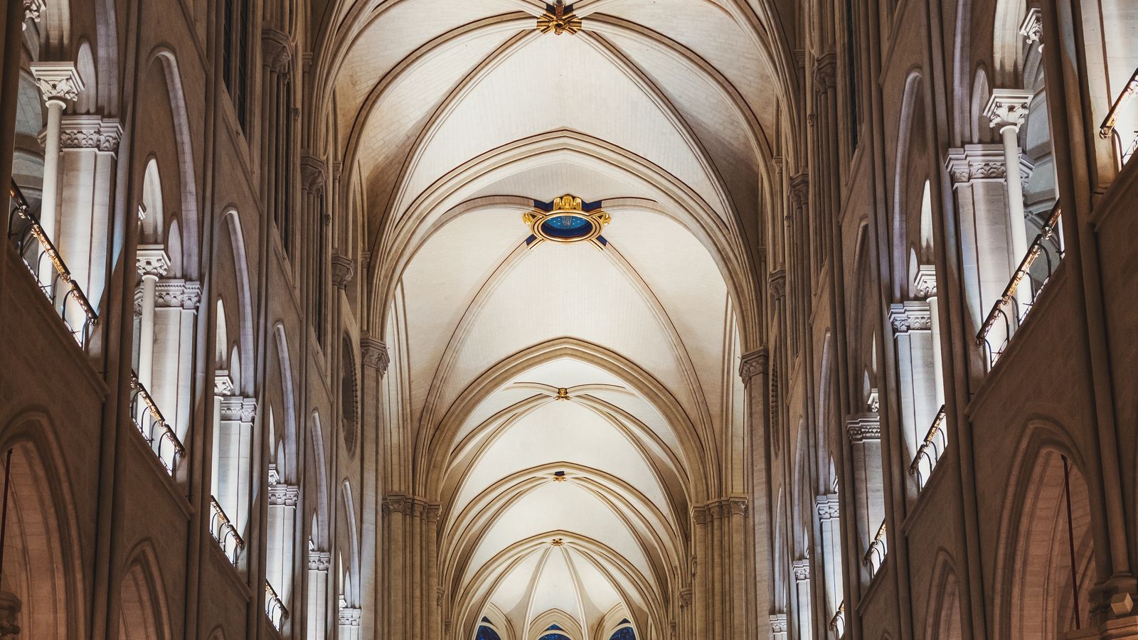 Vaulted Gothic ceiling and stone arches inside Notre-Dame Cathedral in Paris with no people in the frame, an illustrative real photo echoing the medieval Paris setting of Castlevania: Belmont's Curse